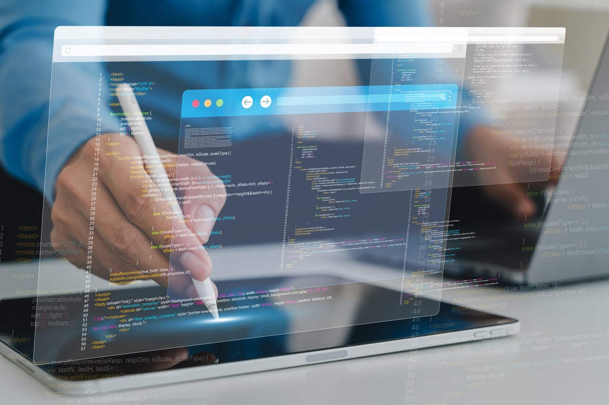 Programmer working on code on a tablet, software development concept